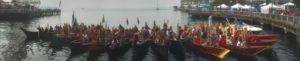 photo of people in Native American canoes in Elliott Bay